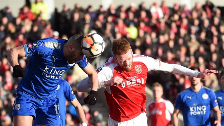 Islam Slimani heads the ball in front of Fleetwood's Cian Bolger
