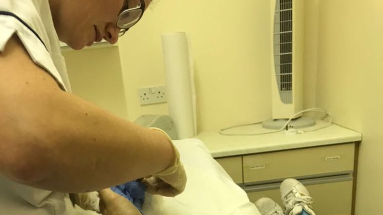 Molly being tended to in the hospital in Wigan