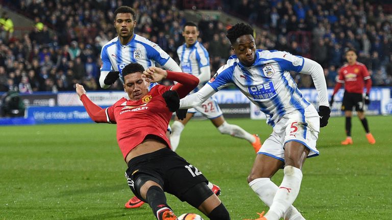 Manchester United's defender Chris Smalling (L)