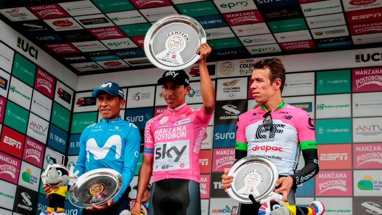 Egan Bernal (C) celebrates his win ahead of Nairo Quintana (L) and Rigoberto Uran (R)