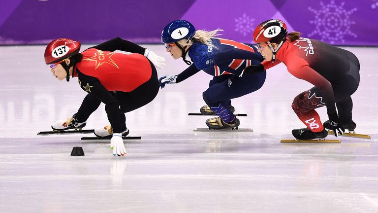 Britain's Elise Christie (C) stormed around the field to win her 1,500m heat in Pyeongchang