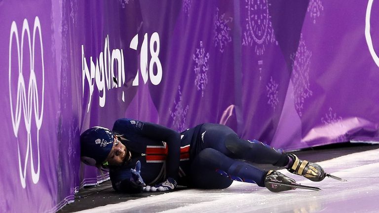 Elise Christie falls after a collision with Jinyu Li of China