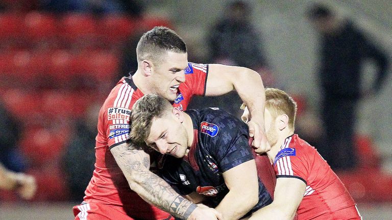 Luke Burgess and Kris Welham tackle George Williams