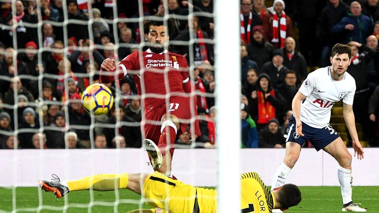 Salah lifts the ball over Hugo Lloris to put Liverpool ahead after 91 minutes