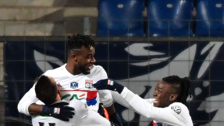 Maxwel Cornet (2ndL) celebrates with his team-mates after scoring