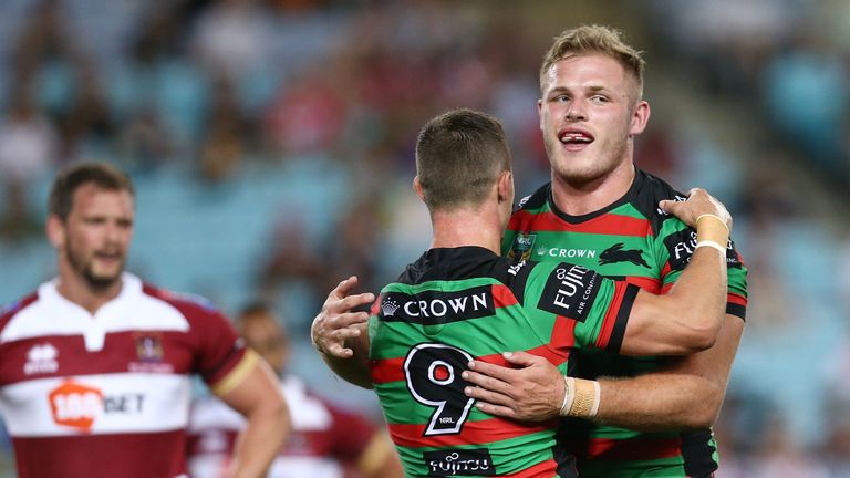 Tom Burgess (right) celebrates with Damien Cook after scoring Souths' first try