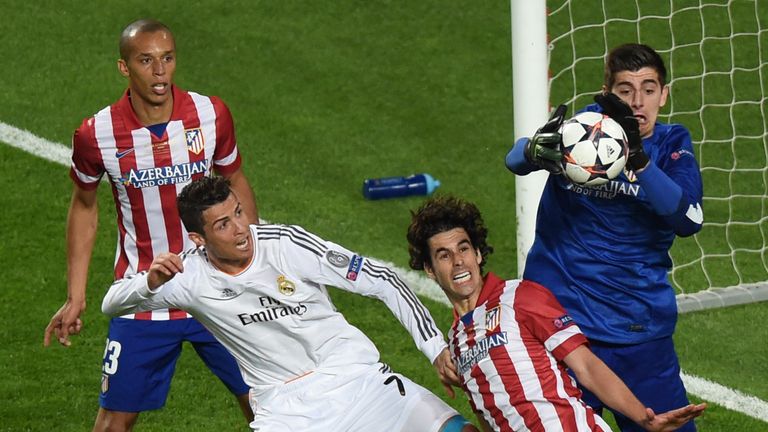 Courtois in action for Atletico Madrid against Real