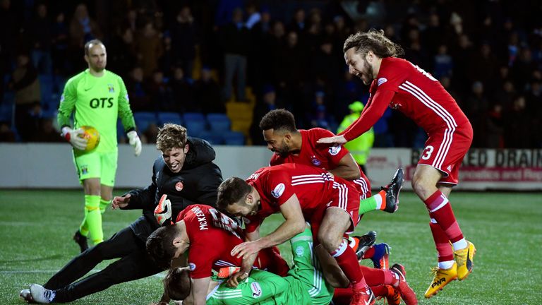 Aberdeen players celebrate their shootout win