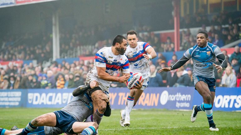 Wakefield's Bill Tupou is tackled as he offloads to Mason Caton-Brown