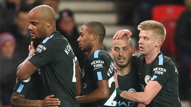 David Silva (centre) is congratulated by his Man City team-mates after opening the scoring against Stoke