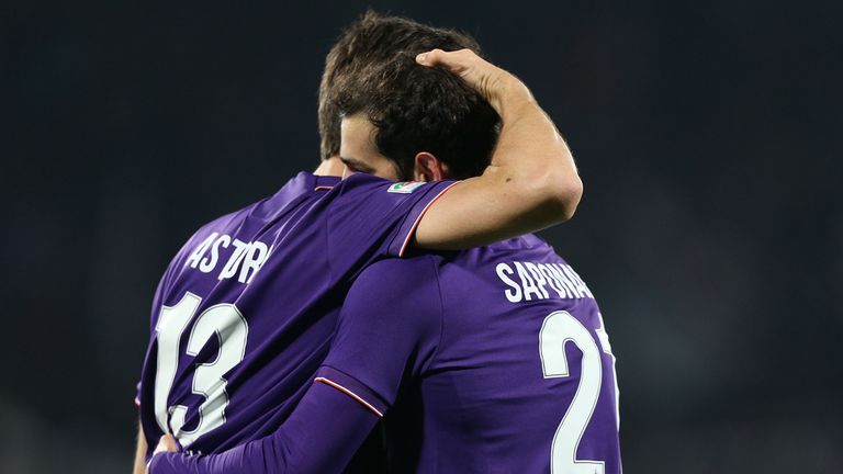 Fiorentina captain Davide Astori embraces team-mate Ricardo Saponora