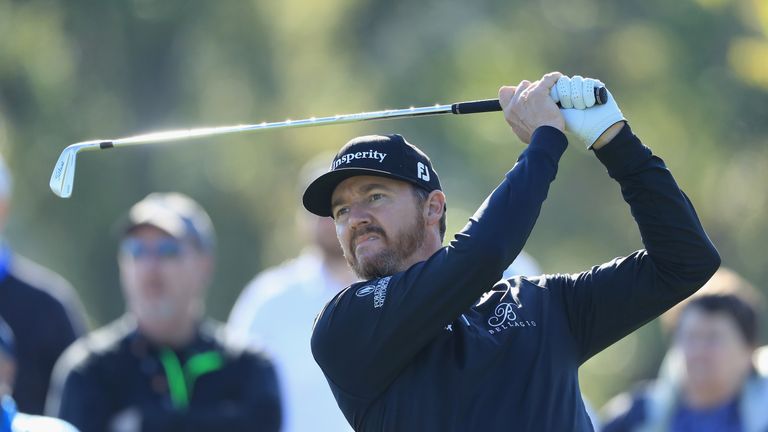 Jimmy Walker's hole-out for eagle lifted him to four over