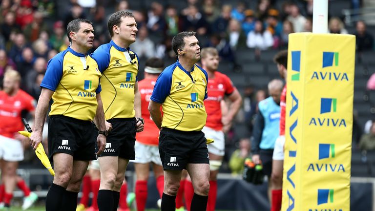 Officials look up at the big screen during an Aviva Premiership game