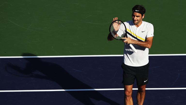 Roger Federer celebrates after beating Federico Delbonis