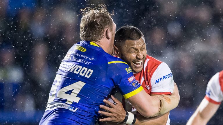 St Helens' Dominique Peyroux is tackled by Warrington's Ben Westwood