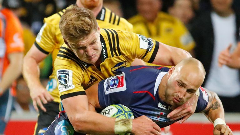 Bill Meakes of the Rebels attacks the Hurricanes' defence