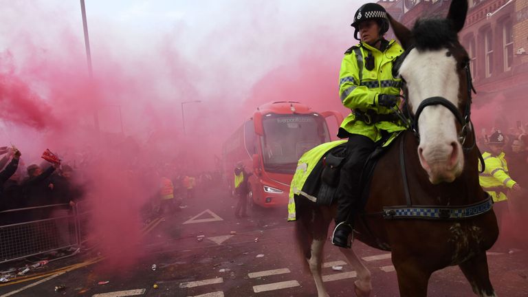 Police keep control as Liverpool's team bus arrives before the game