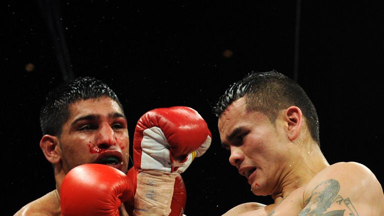Amir Khan had to take plenty of shots in the second half of the fight - but surived