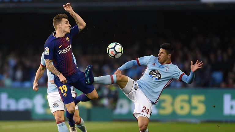 Facundo Roncaglia of Celta Vigo competes for the ball with Lucas Digne
