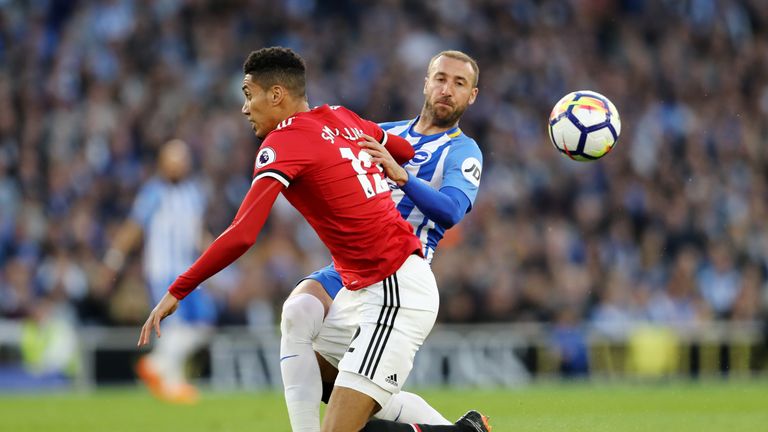 Chris Smalling challenges Glenn Murray in the opening exchanges at the Amex