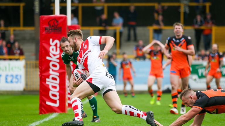 St Helens' Danny Richardson runs in for a try.