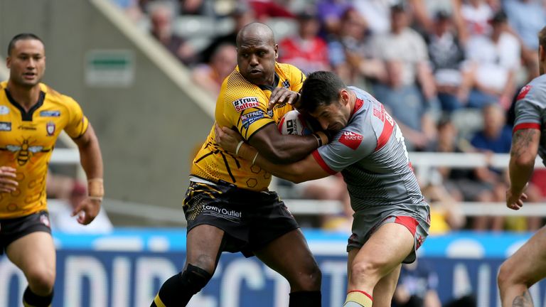 Salford's Robert Lui and Catalans Dragons' Benjamin Garcia battle for the ball 