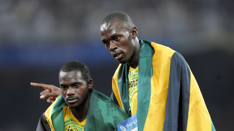 Carter with Bolt following the 4x100 relay in 2008