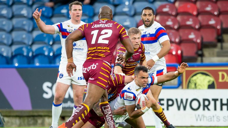 Wakefield's Mason Caton-Brown protests after being brought down by Huddersfield