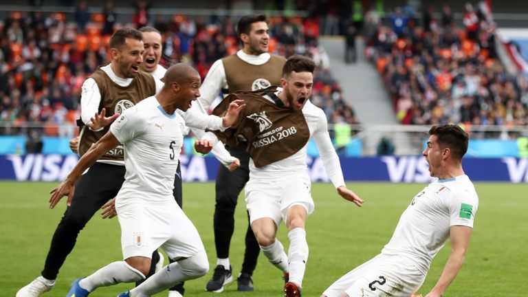 Jose Gimenez celebrates his last-gasp winner with Uruguay team-mates