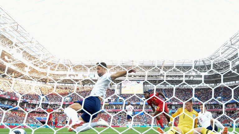 Cahill makes a goal-line clearance to prevent Belgium taking an early lead in Kaliningrad