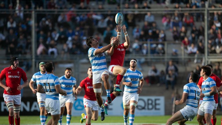 Hallam Amos   competes for a high ball against Argentina