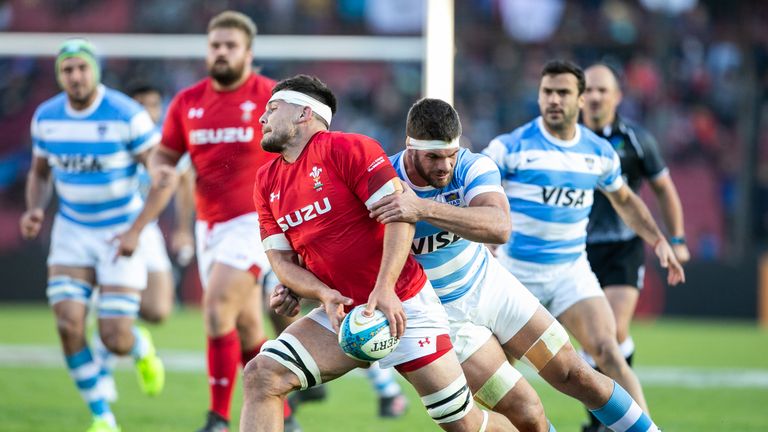 Ellis Jenkins (front-L) from Wales is tackled by Argentina's Marcos Kremer