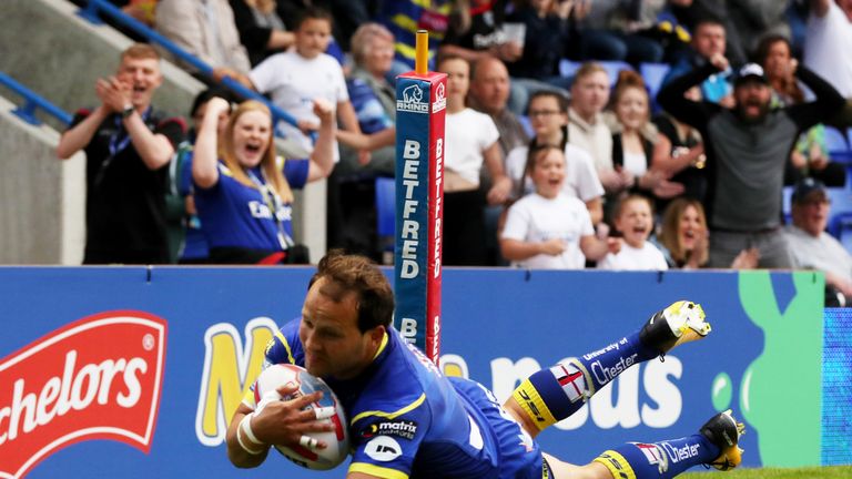Tyrone Roberts dives over the line for Warrington's first try