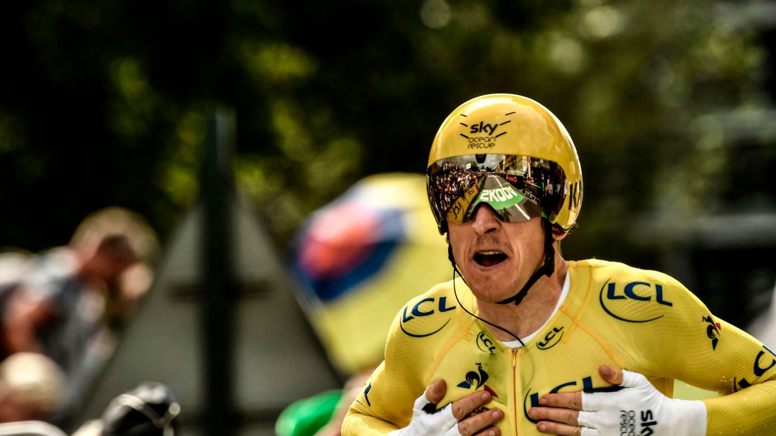 Geraint Thomas celebrates after all but assuring himself of Tour de