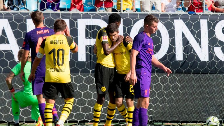 Pulisic (2nd R) scored twice against Liverpool