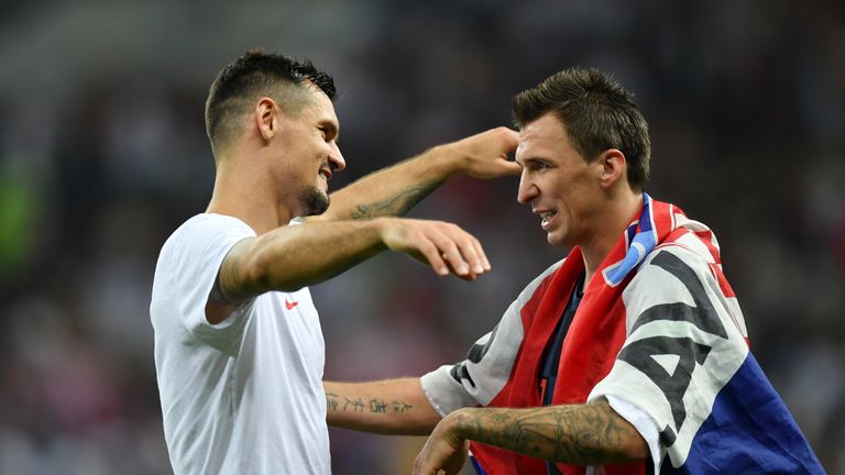 Lovren celebrates with Mario Mandzukic, whose extra-time goal fired Croatia into the final