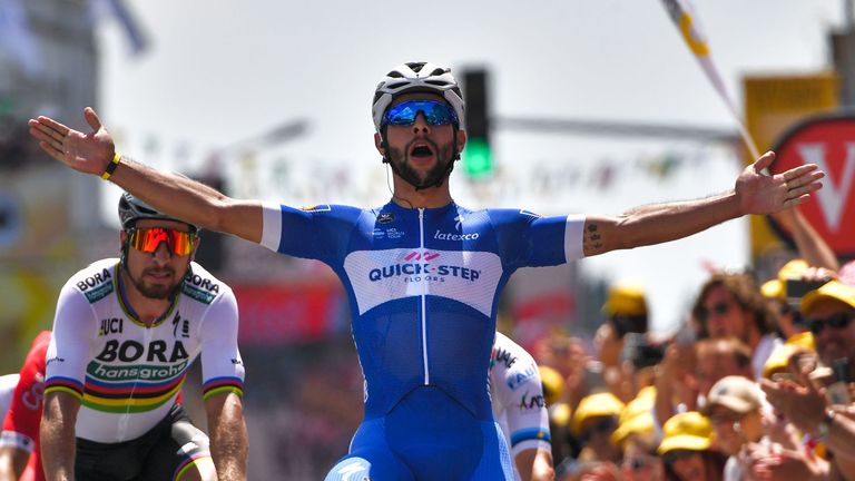 Fernando Gaviria celebrates as he crosses the line