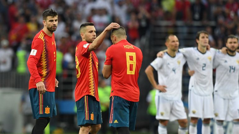 Koke is consoled after seeing his penalty for Spain against Russia saved in the shootout