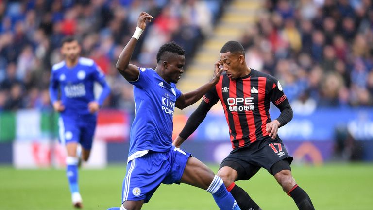 Daniel Amartey (L) battles for possession with Rajiv van La Parra (R)
