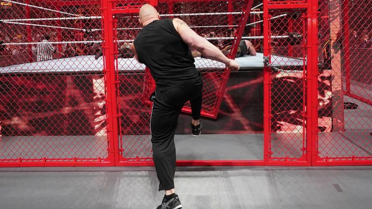 Lesnar interferes and smashes through cell door
