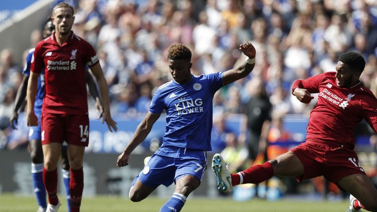 Demarai Gray shoots under pressure from Joe Gomez (right)