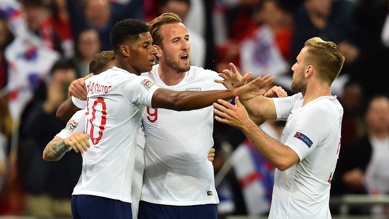 Marcus Rashford celebrates his opening goal with Harry Kane, Luke Shaw and Kieran Trippier