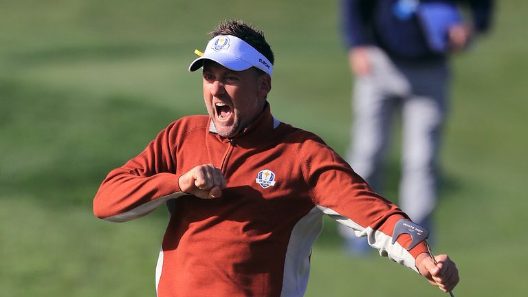 Poulter celebrates after sinking a putt
