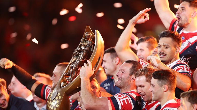 Rooster captain Boyd Cordner holds aloft the Provan-Summons Trophy