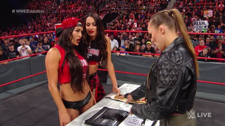 One week after they exchanged several jaw-dropping insults, Ronda Rousey and Nikki Bella step into the ring to solidify their title match for WWE Evolution, the first-ever all women's pay-per-view.