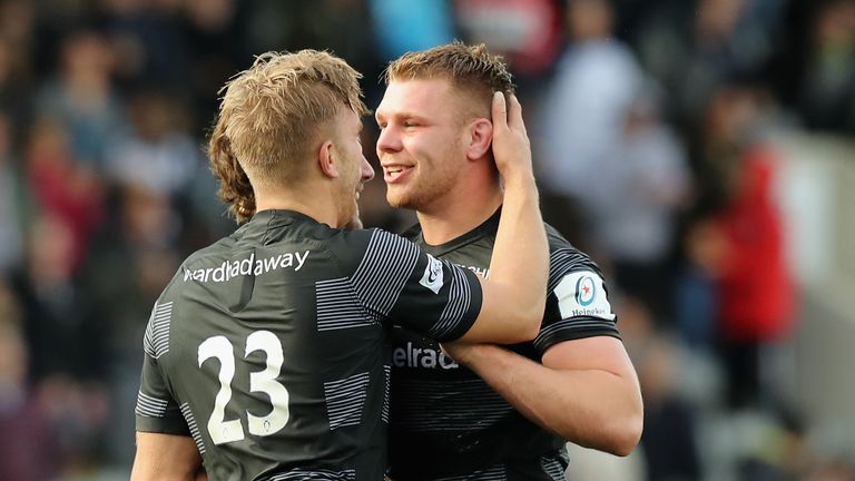 Callum Chick (right) is congratulated by team-mates after scoring the winning try for Newcastle