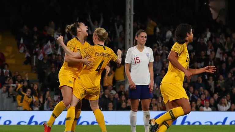 Clare Polkinghorne celebrates after scoring against England