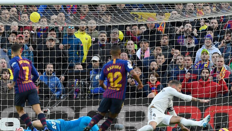 Philippe Coutinho (left) scores in El Clasico