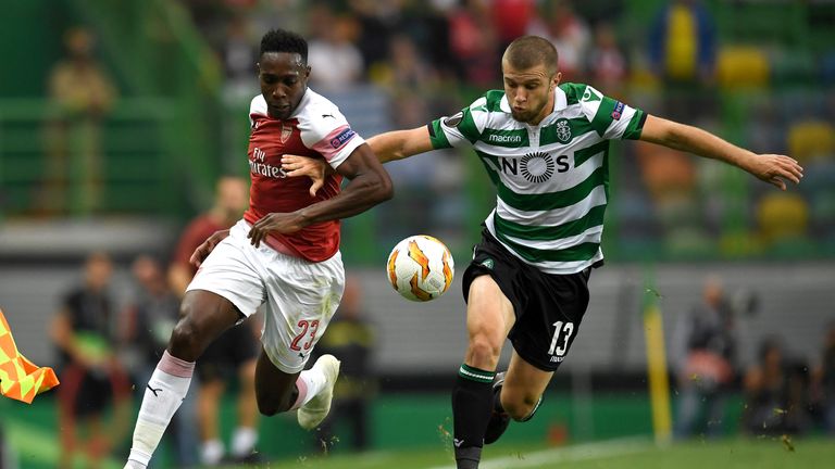 Danny Welbeck and Stefan Ristovski fight for the ball