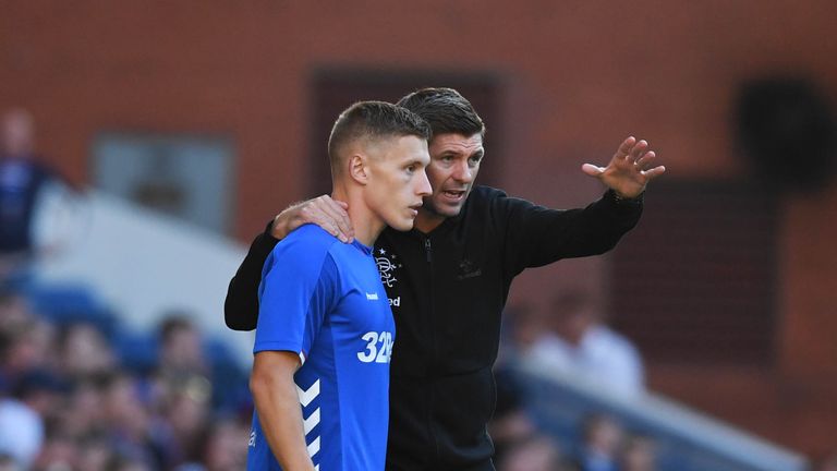 Rangers manager Steven Gerrard speaks with Greg Docherty